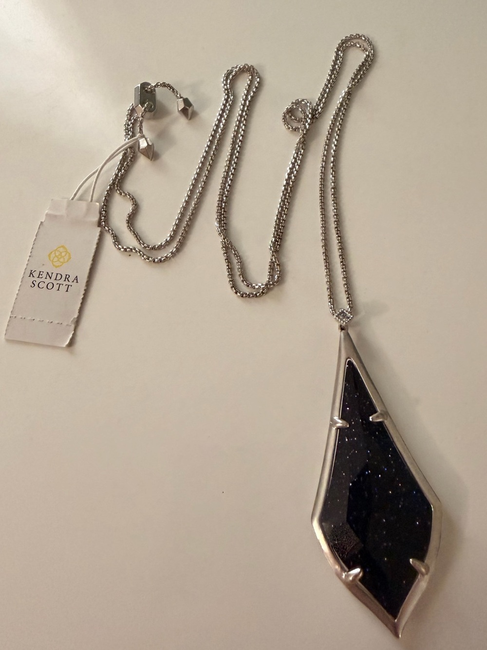 NWT Kendra Scott Olivia Pendant in Rhodium with Navy Glitter Glass
